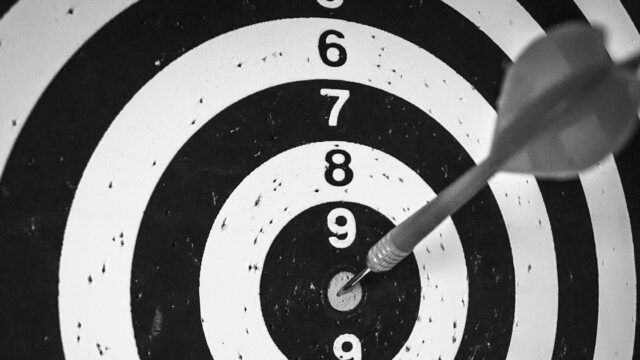 Darts on TV guide: a dart in the centre of a black and white target